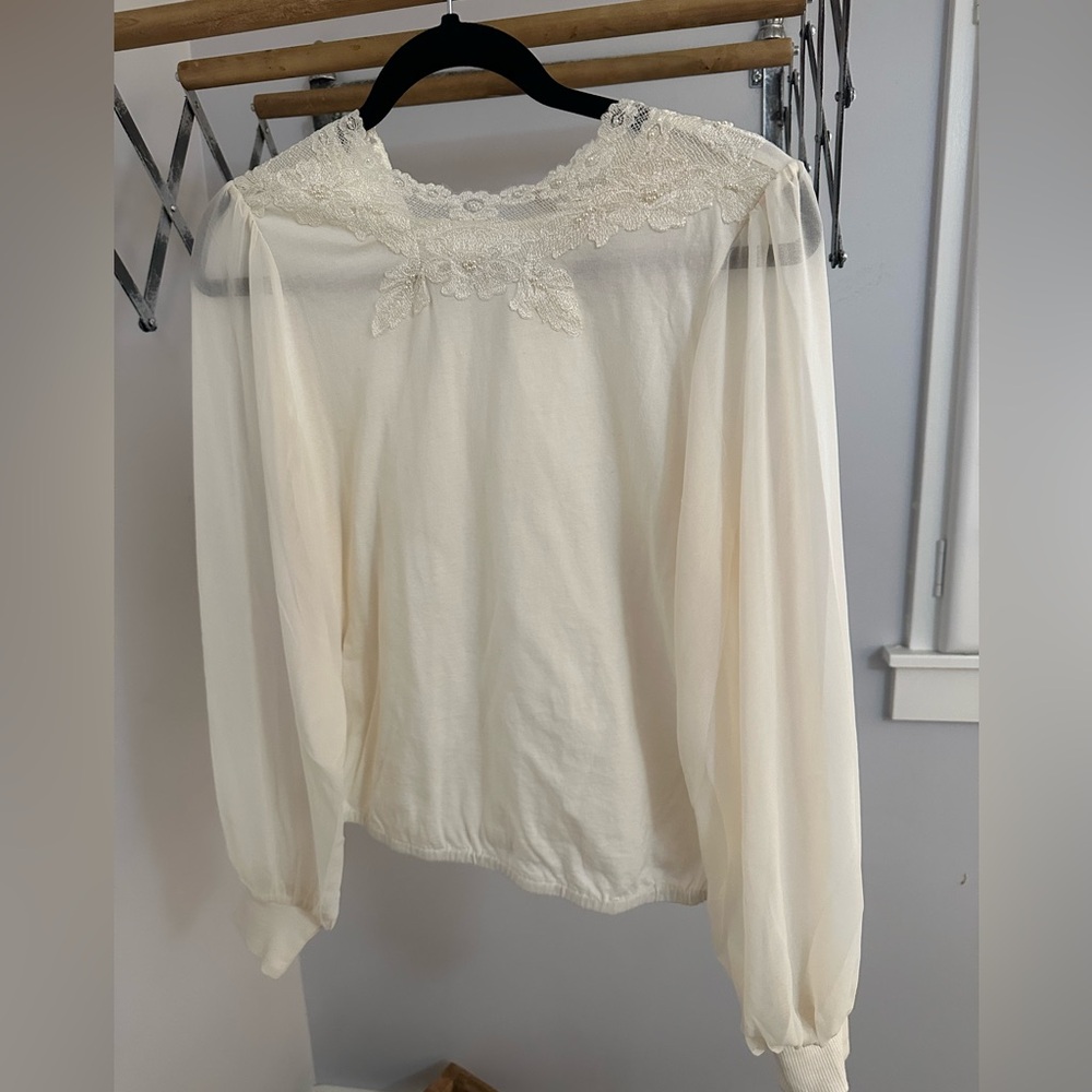 Cute cream top with embellishments. Bought at Anthropologie.